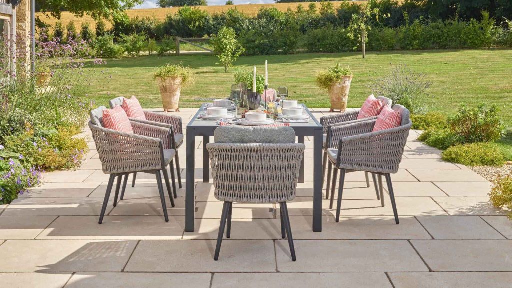 bramblecrest mauritius 164 x 95cm rectangle dining table with 6 chairs & parasol X23AMA164RT1 lifestyle 3