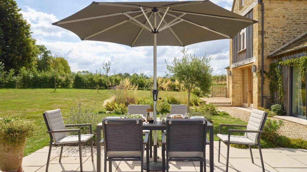 bramblecrest zurich 164 x 95cm rectangle tree free table with 6 chairs & parasol eco fawn X23AZR164RT1 lifestyle 2